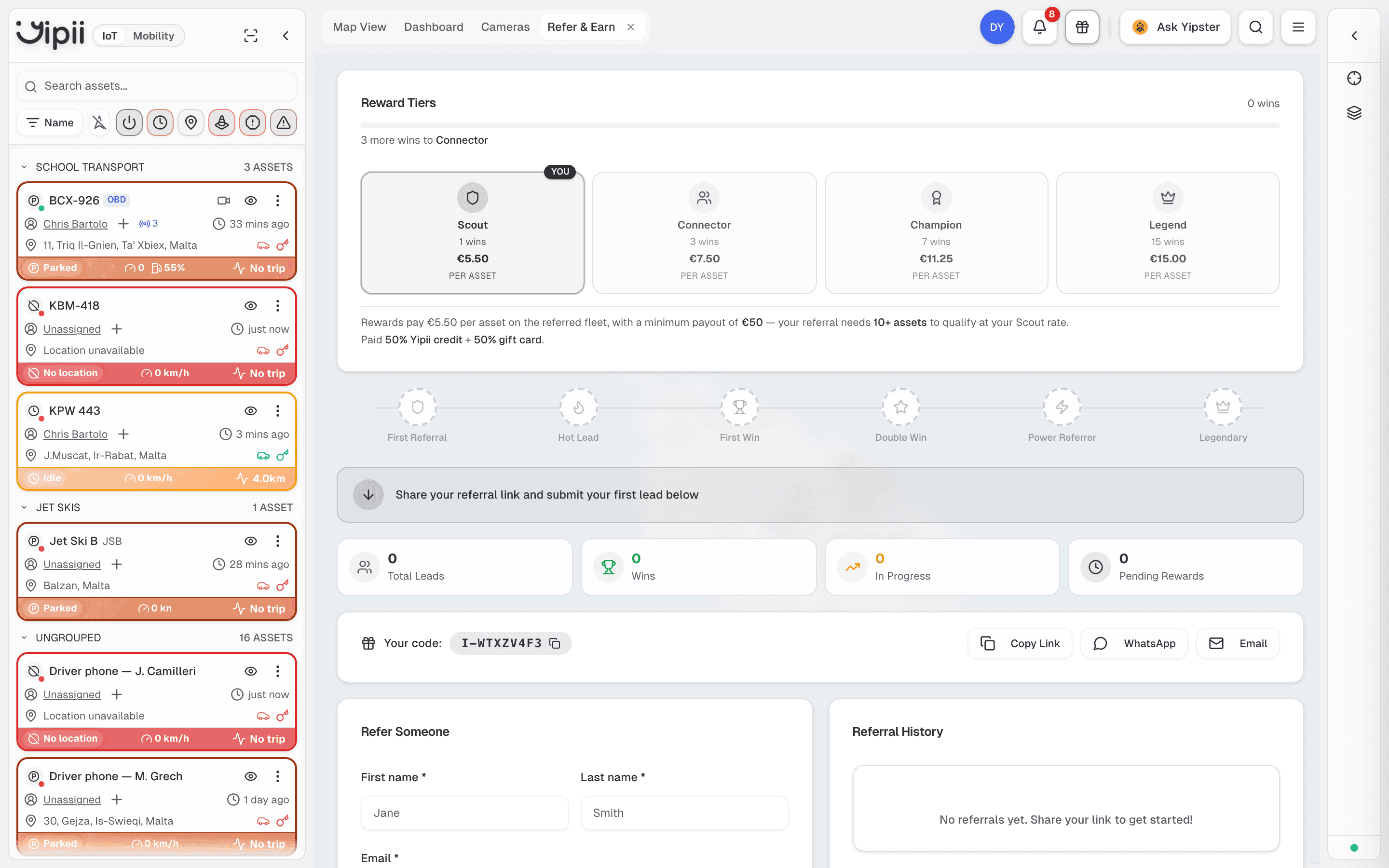 The Refer & Earn screen, with reward tiers, the badge track, your referral code and the lead form